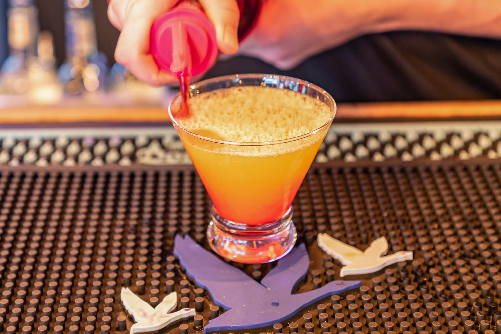 Craft cocktails poured at the bar beside smash burgers at John King Grill on King Street in Charleston